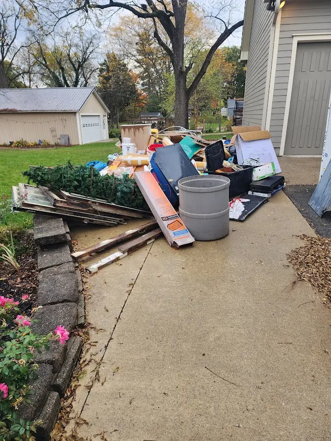 Dumpster being loaded with debris for Demolition Dumpster Rental in Corning